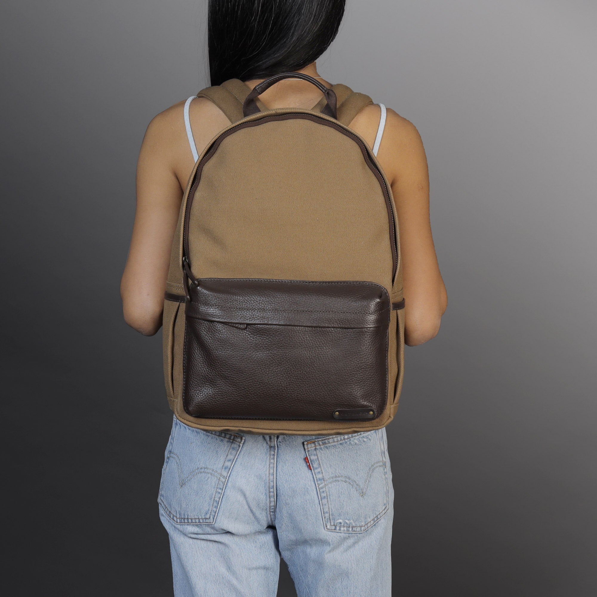 Journey Canvas Backpack featuring padded laptop section, multiple pockets, and durable water-resistant material.