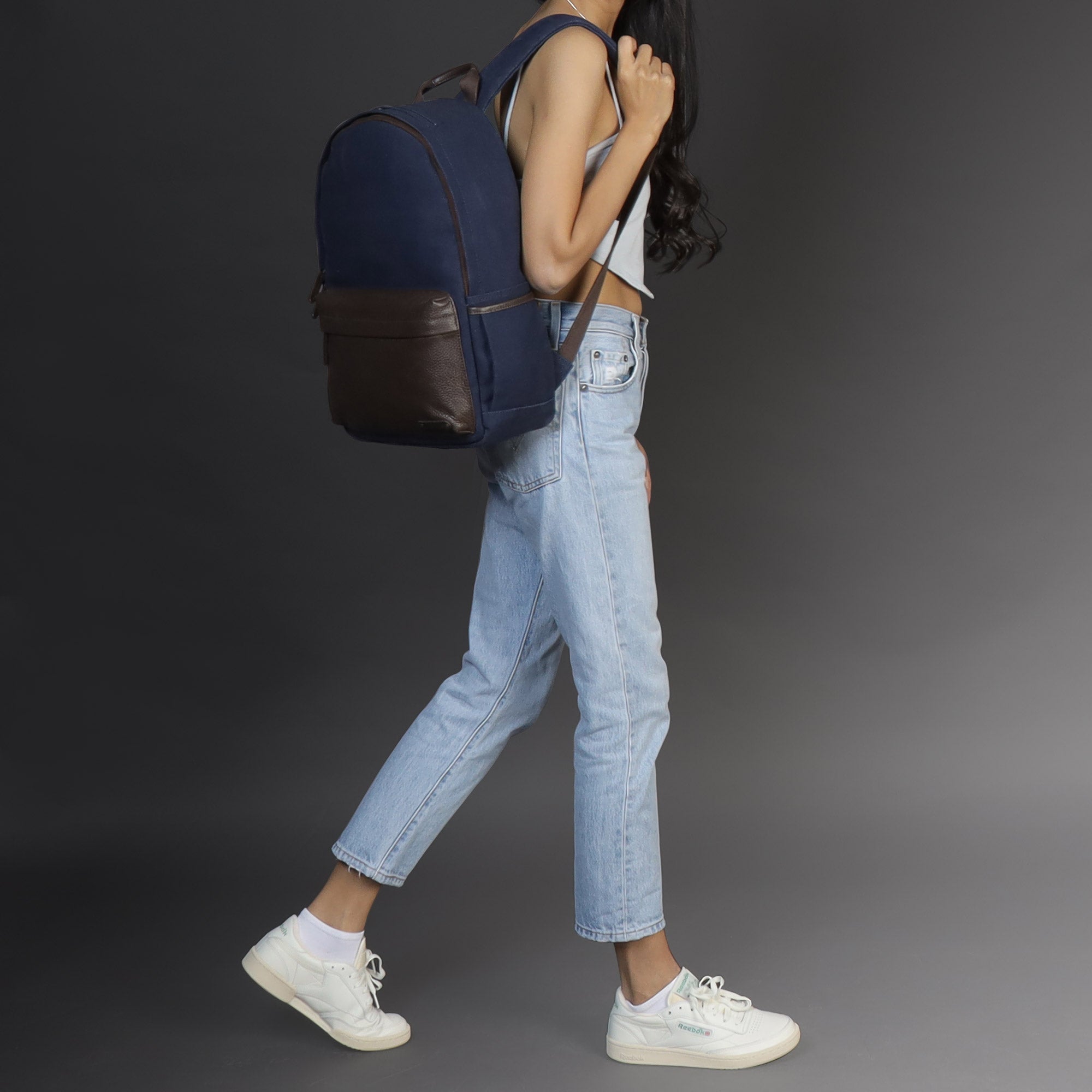 Journey Canvas Backpack featuring padded laptop section, multiple pockets, and adjustable straps, made from durable water-resistant cotton canvas.