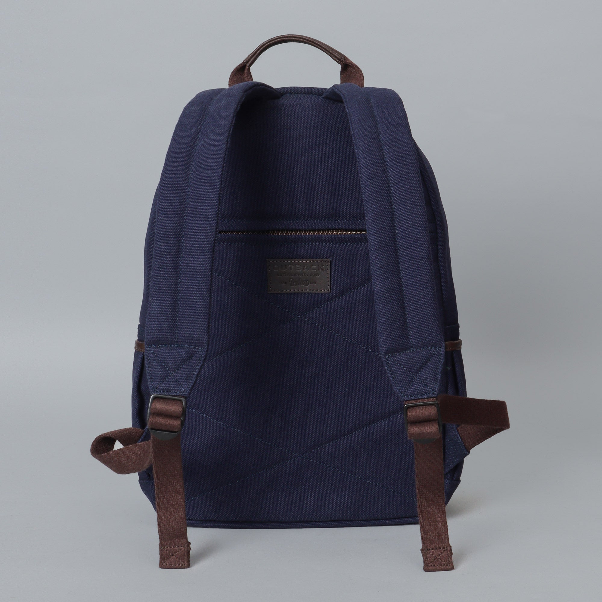 Journey Canvas Backpack featuring padded laptop section, multiple pockets, and adjustable straps, made from durable water-resistant cotton canvas.