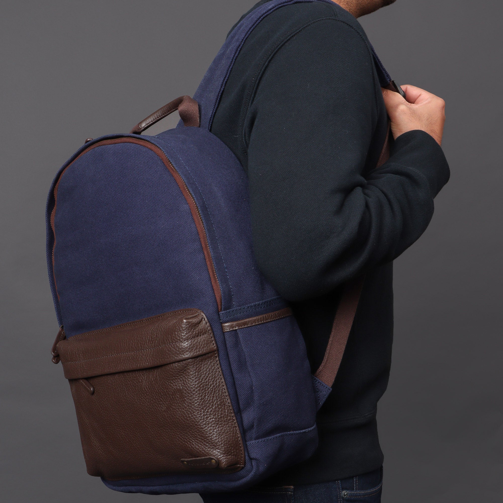 Journey Canvas Backpack featuring padded laptop section, multiple pockets, and adjustable straps, made from durable water-resistant cotton canvas.