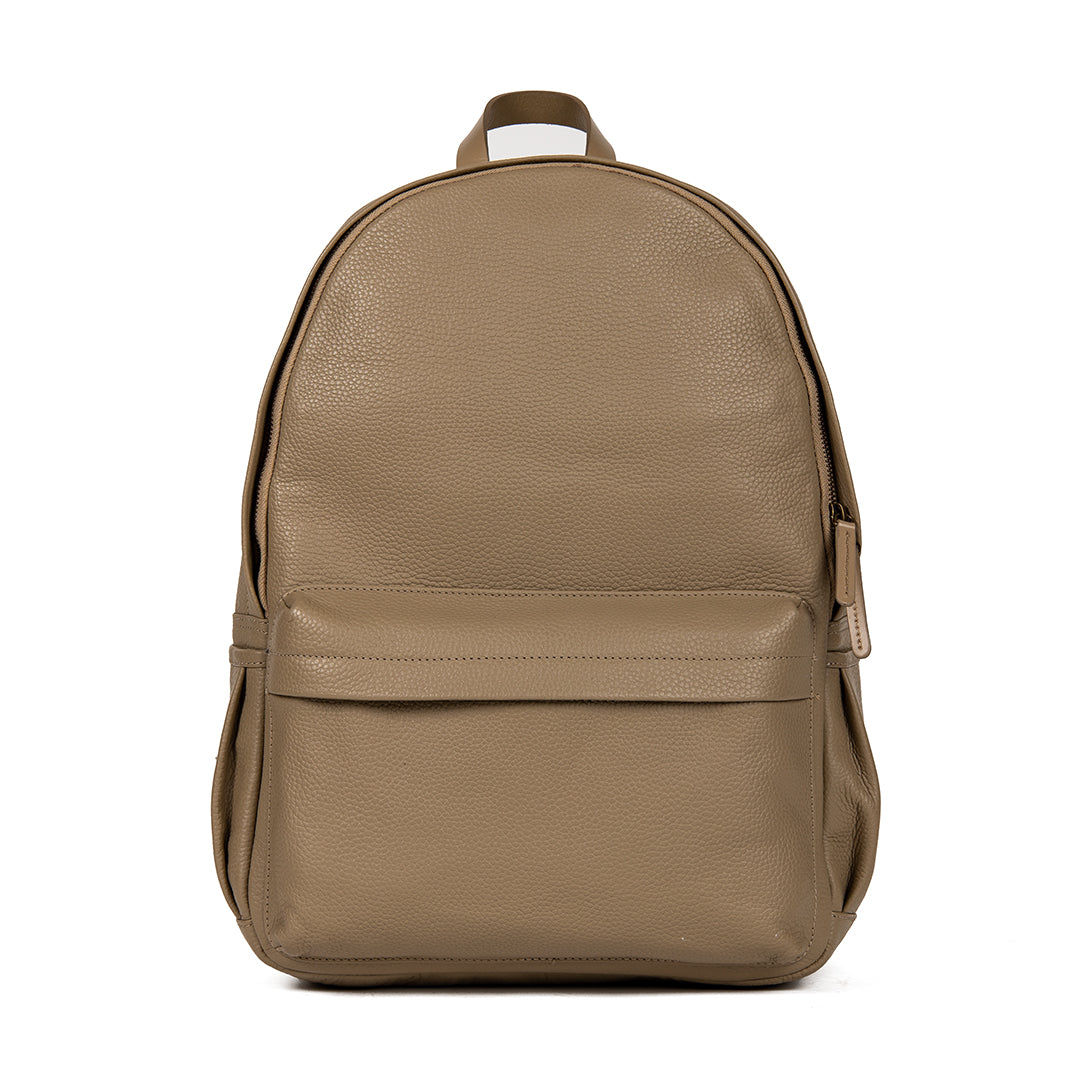 A stylish Journey Leather Backpack made from premium full grain leather, featuring multiple pockets and padded shoulder straps for comfort.