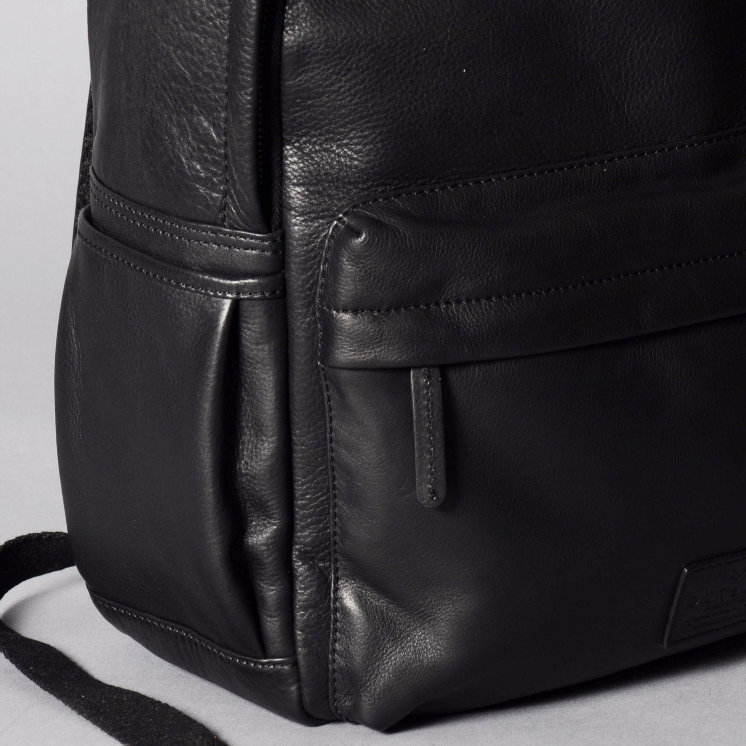 A stylish Journey Leather Backpack made from premium full grain leather, featuring multiple pockets and a padded laptop compartment.