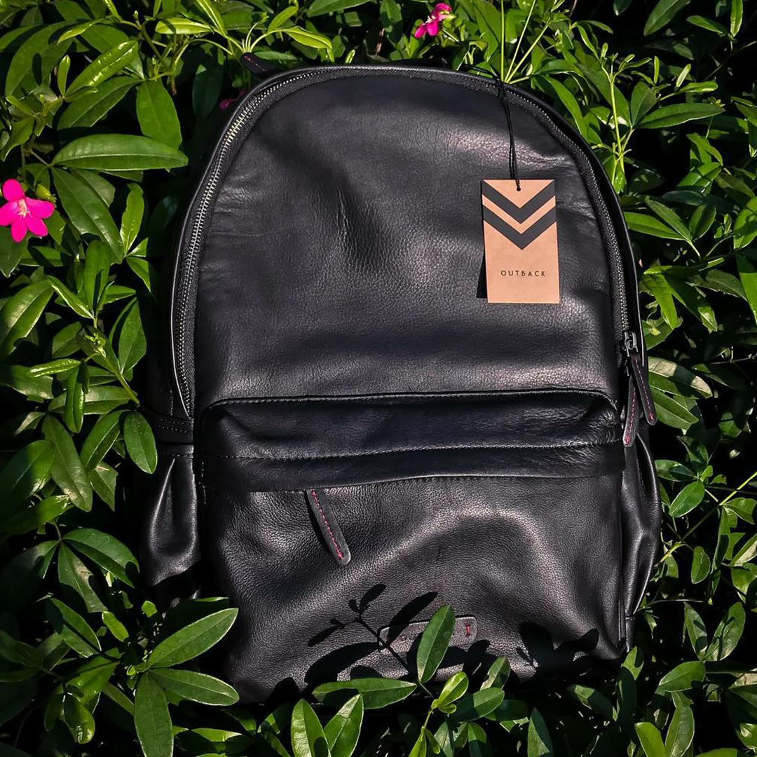 A stylish Journey Leather Backpack made from premium full grain leather, featuring multiple pockets and padded straps for comfort.