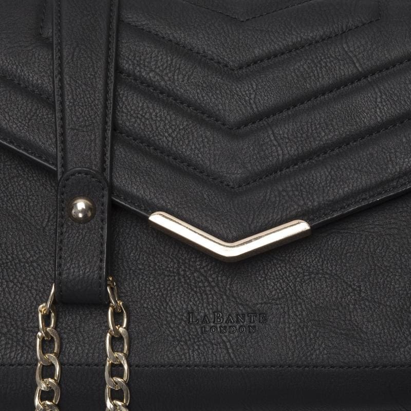 Kensington Black Vegan Leather CrossBody Bag with double gold chain strap and V-shape quilting design.