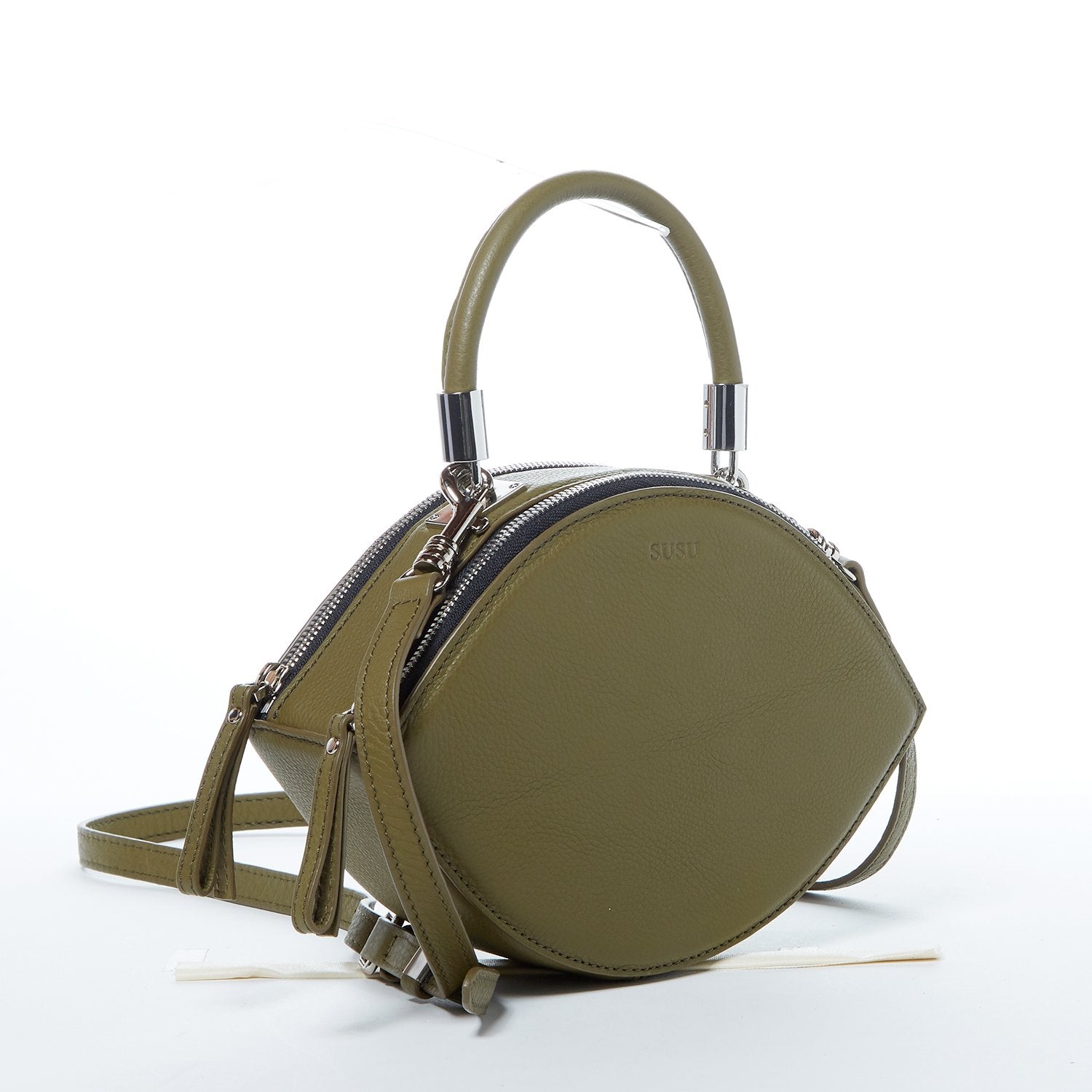 Olive green leather circle crossbody bag with silver hardware and teal lining, featuring adjustable strap and double zipper compartments.