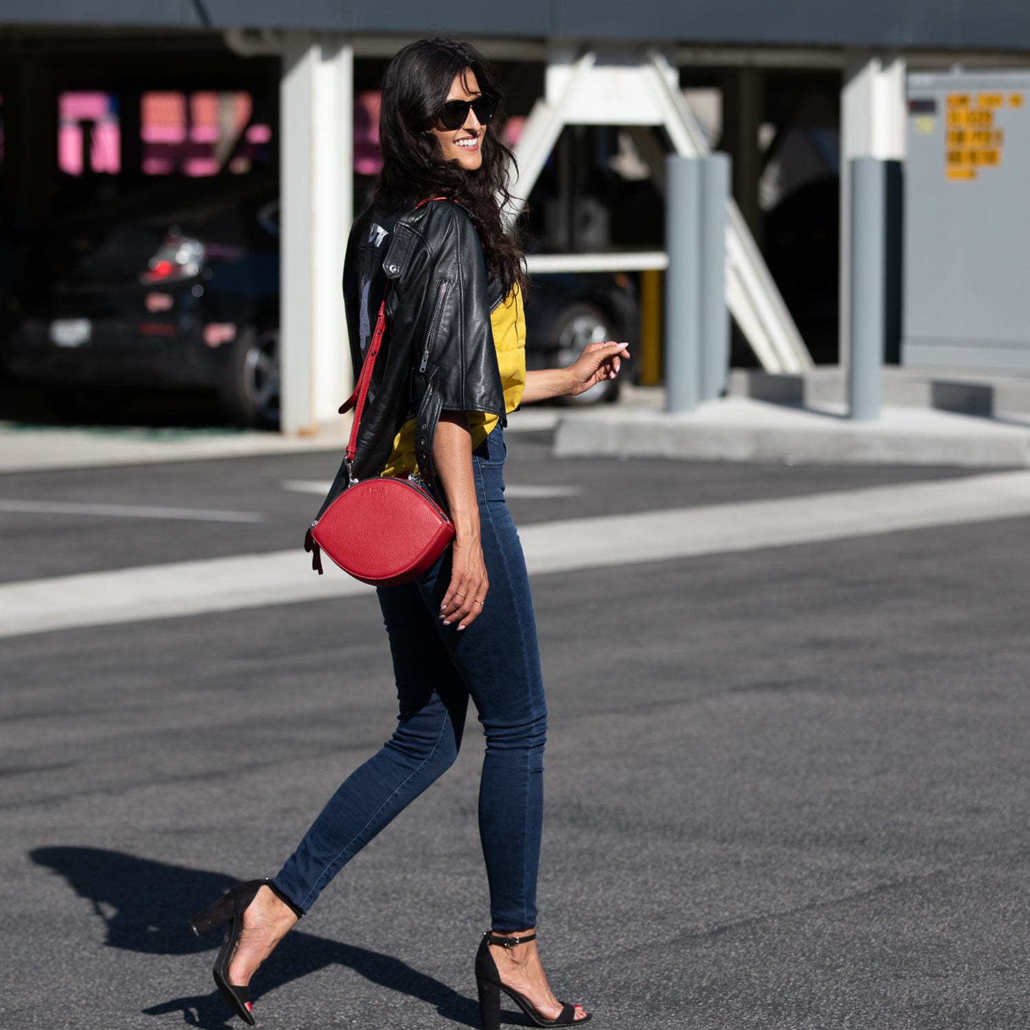 Kiss Circle Shape Leather Crossbody Bag in vibrant chili pepper red with silver hardware and teal lining.