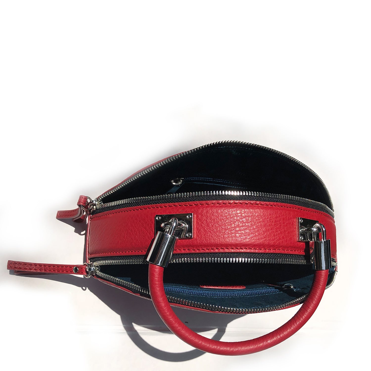 Kiss Circle Shape Leather Crossbody Bag in vibrant chili pepper red with silver hardware and teal lining.