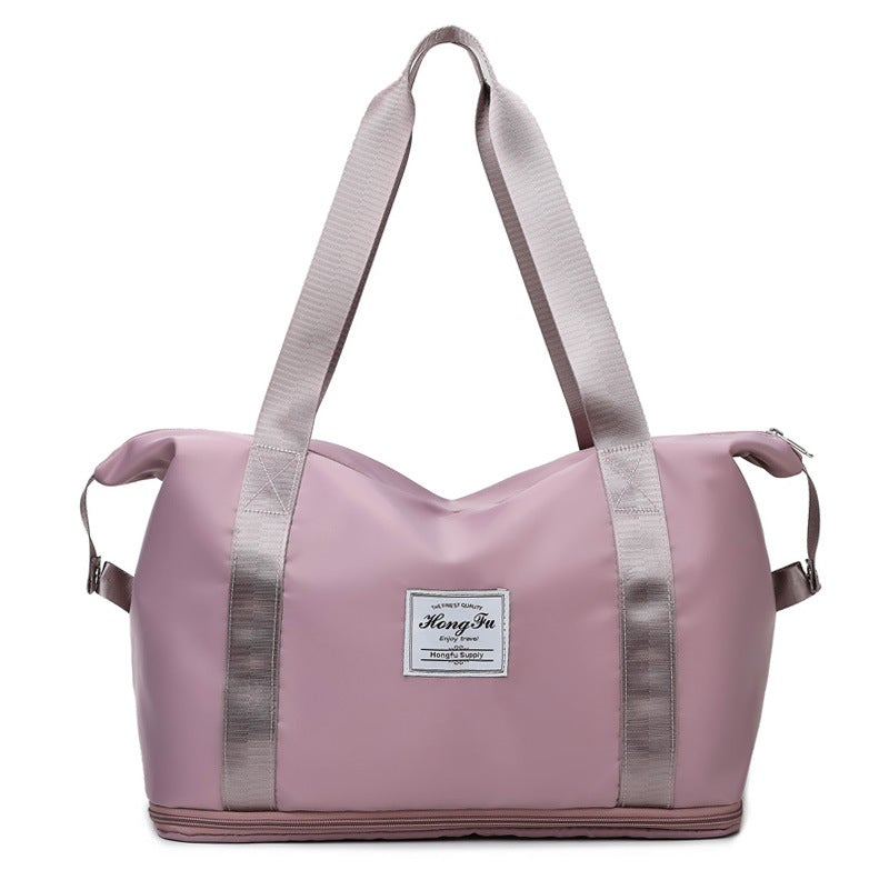 Korean style female short-distance portable travel bag in nylon, featuring a soft handle and square vertical section design.