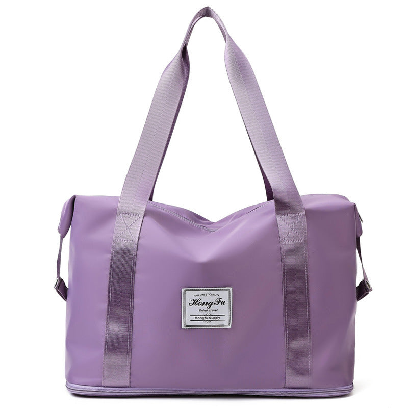 Korean style female short-distance portable travel bag in nylon, featuring a soft handle and square vertical section design.