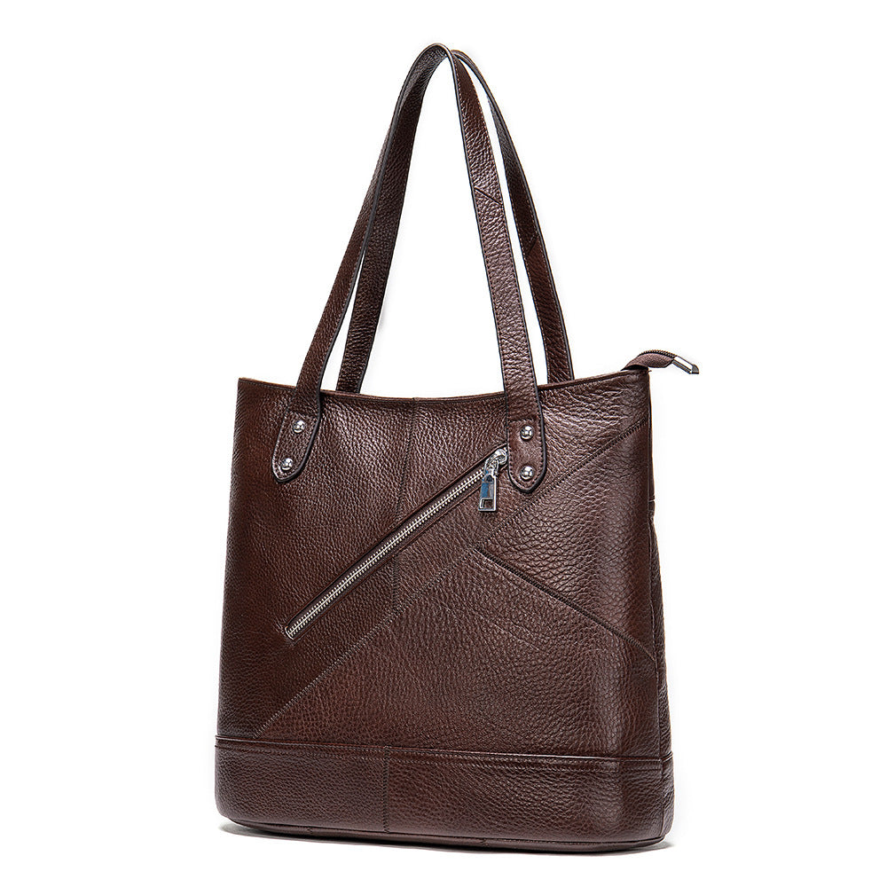 A stylish Ladies Casual Large Capacity Leather Bucket Handbag made from first layer cowhide, featuring a soft surface and secure zipper opening.