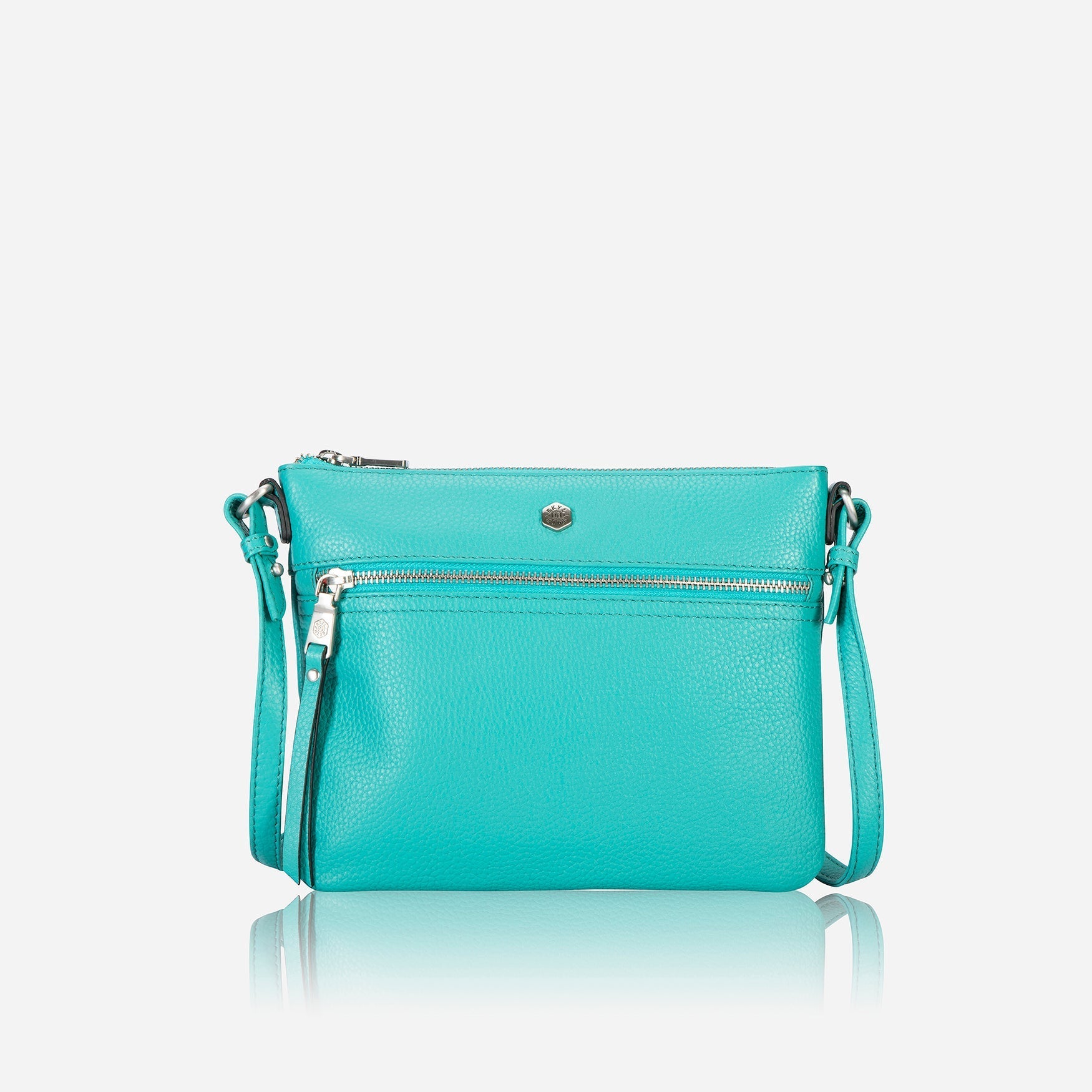 Ladies Crossbody bag in Calypso Teal with adjustable straps and RFID protection, showcasing its stylish design and spacious interior.