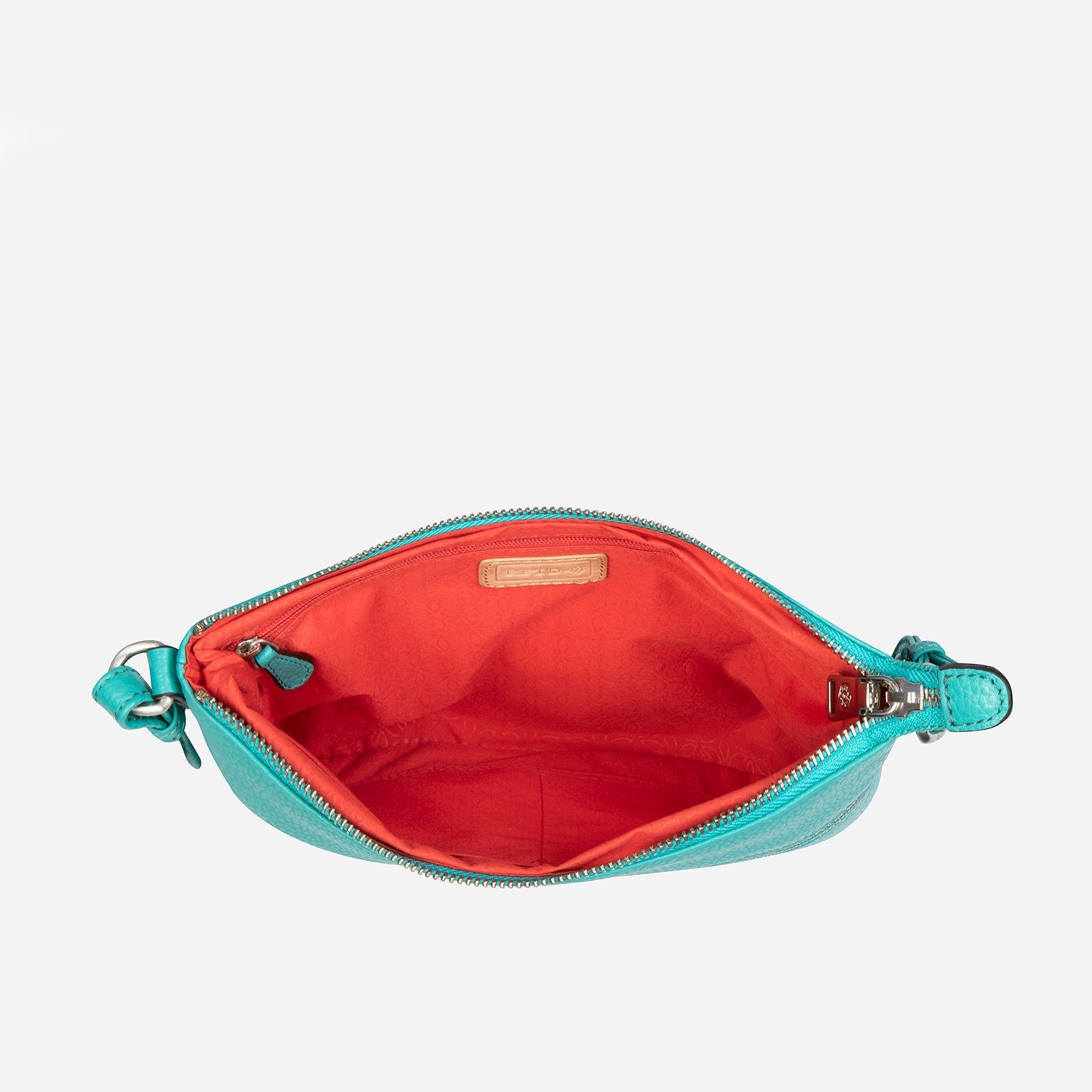 Ladies Crossbody bag in Calypso Teal with adjustable straps and RFID protection, showcasing its stylish design and spacious interior.