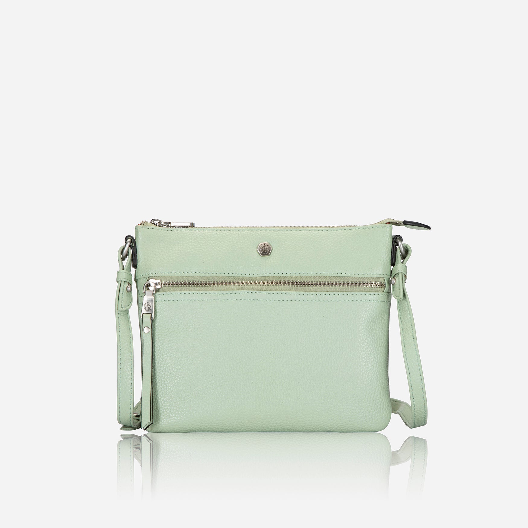 Ladies Crossbody bag in sage green with adjustable straps and RFID protection, showcasing its stylish design and spacious interior.