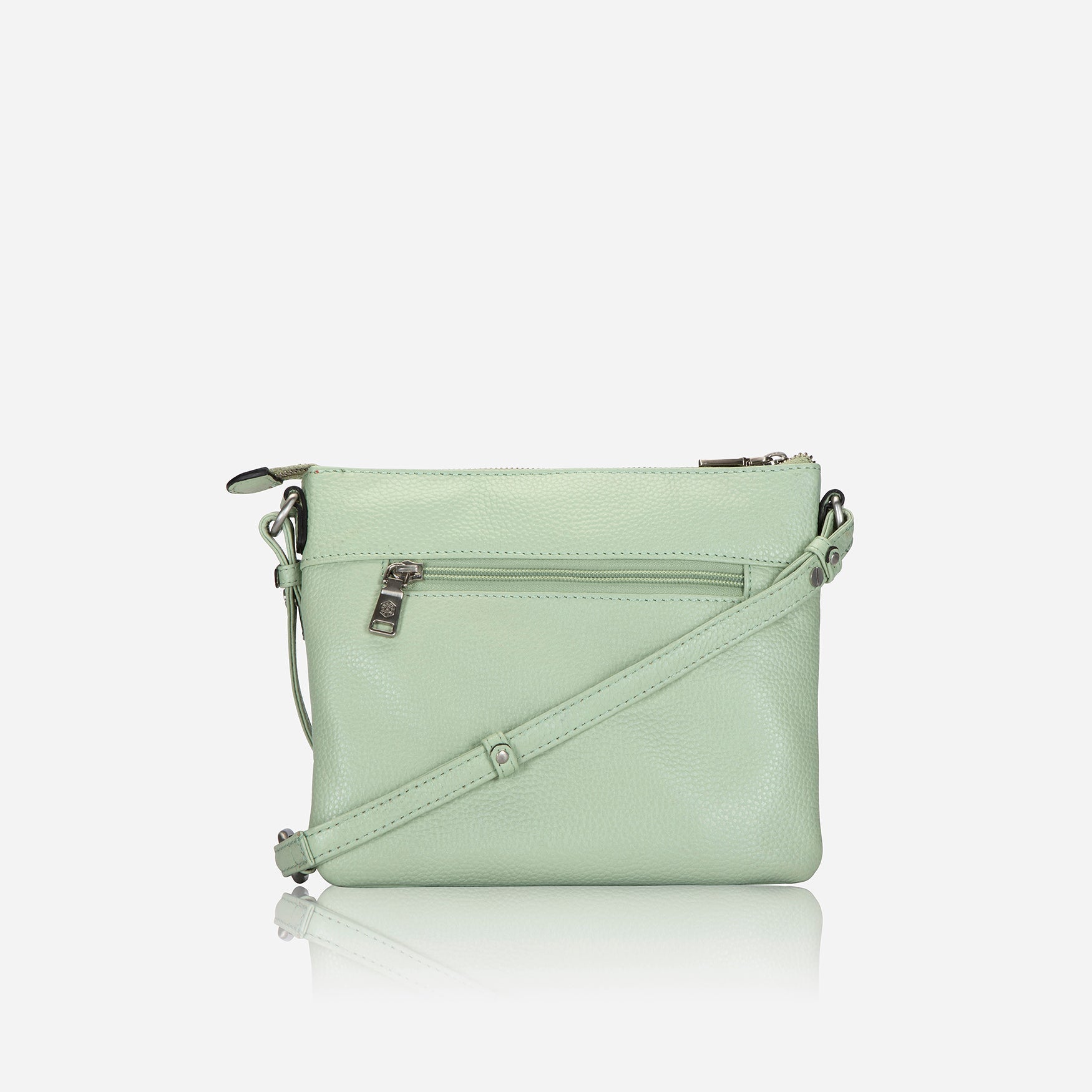 Ladies Crossbody bag in sage green with adjustable straps and RFID protection, showcasing its stylish design and spacious interior.