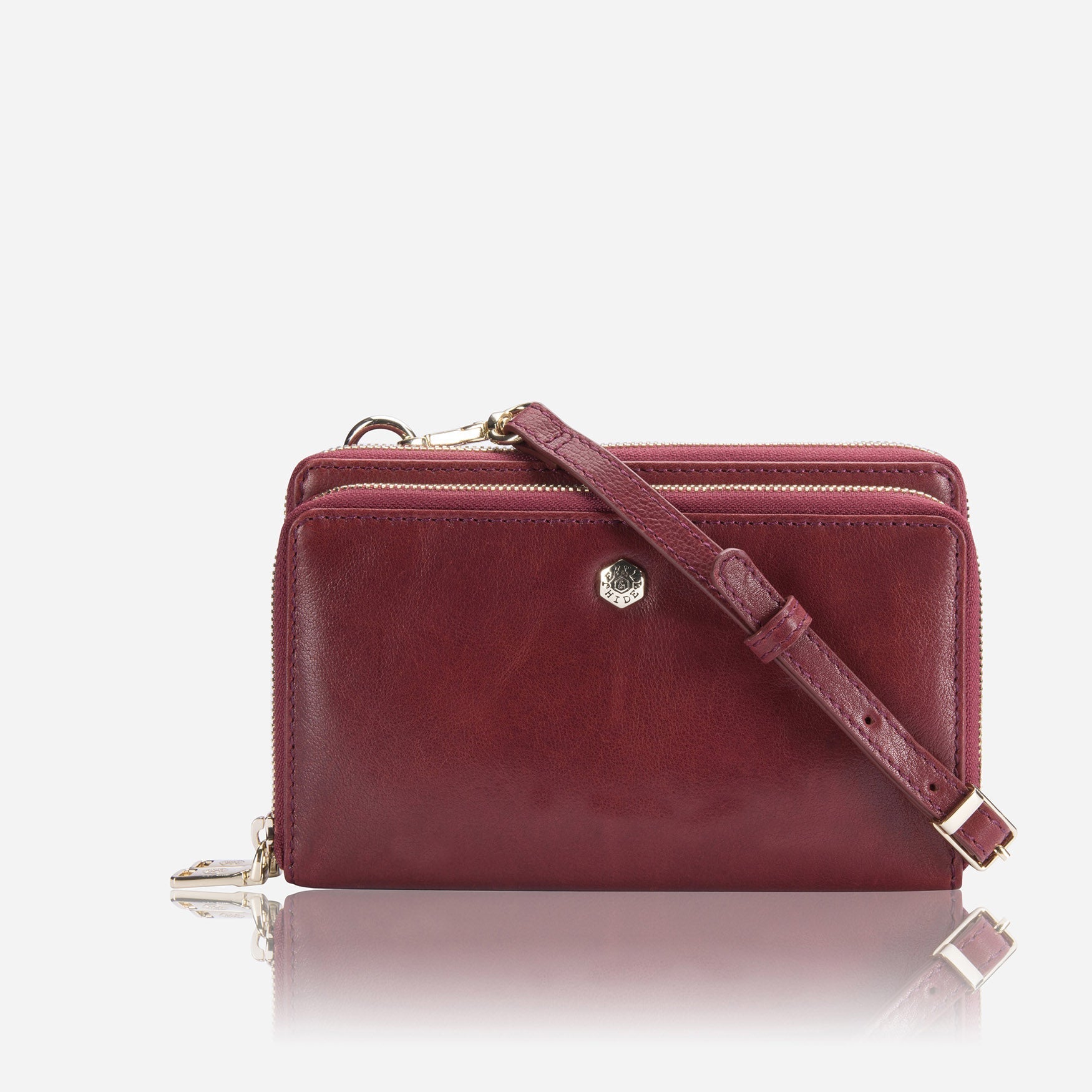 A stylish red ladies purse with a detachable strap, showcasing its chic design and spacious interior.