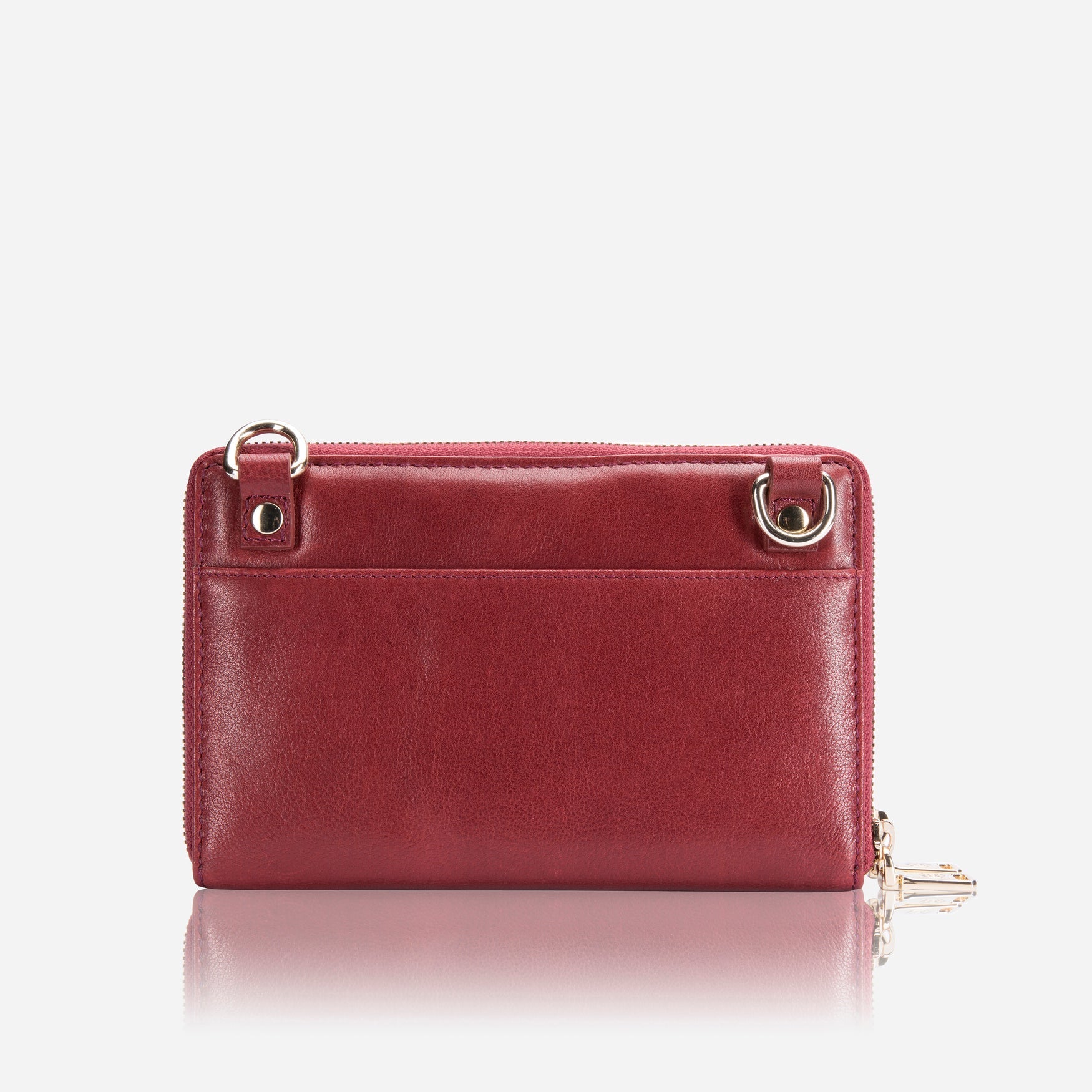 A stylish red ladies purse with a detachable strap, showcasing its chic design and spacious interior.