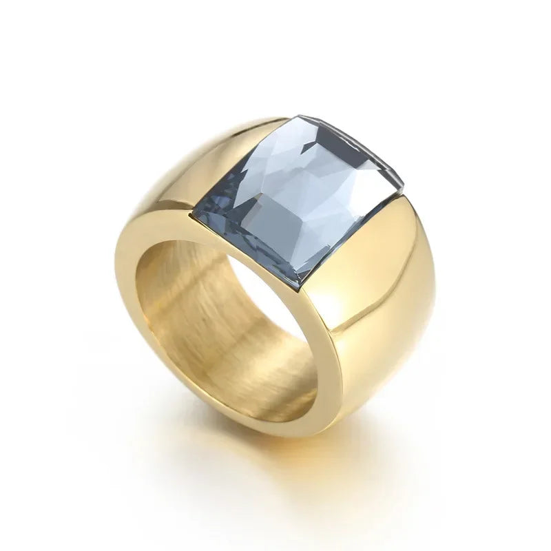 A large crystal stone ring made of stainless steel with a round Austrian crystal centerpiece, showcasing a trendy design for women.