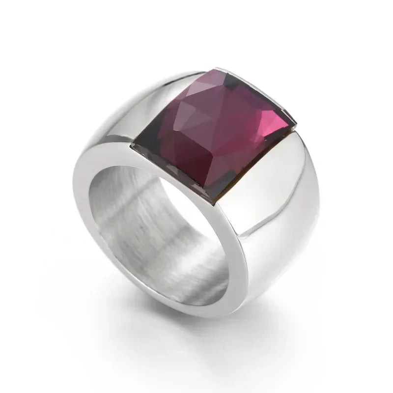 A large crystal stone ring made of stainless steel with a round Austrian crystal centerpiece, showcasing a trendy design for women.