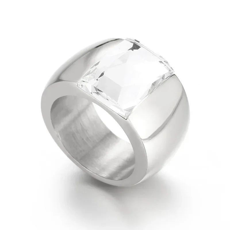 A large crystal stone ring made of stainless steel with a round Austrian crystal centerpiece, showcasing a trendy design for women.