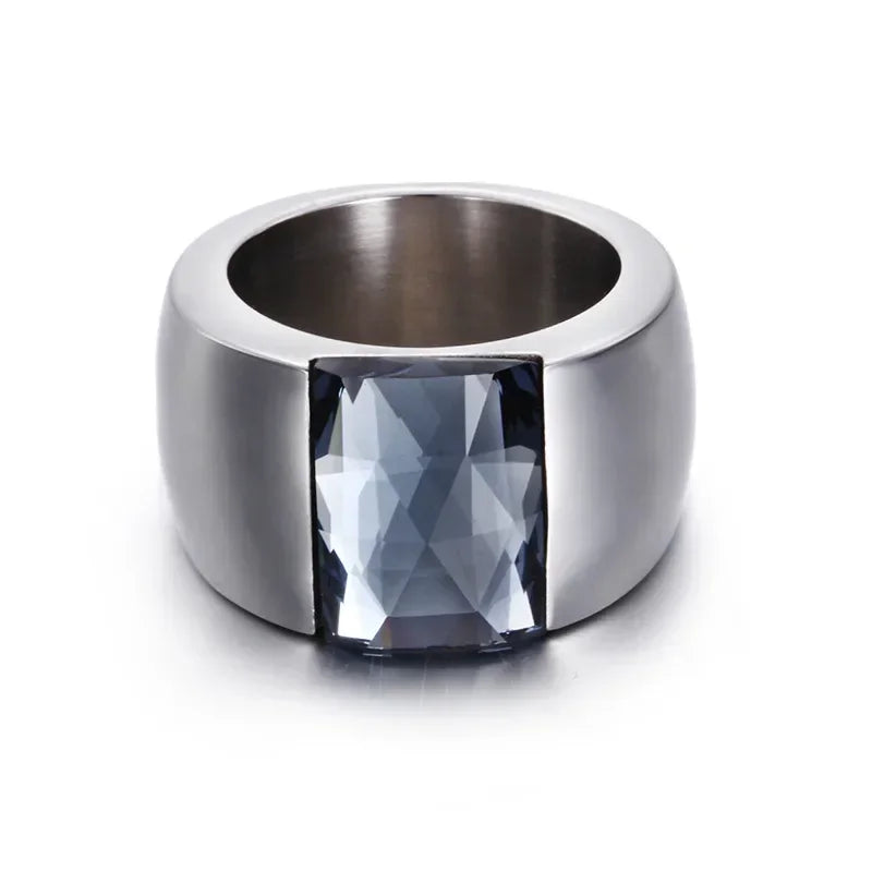 A large crystal stone ring made of stainless steel with a round Austrian crystal centerpiece, showcasing a trendy design for women.