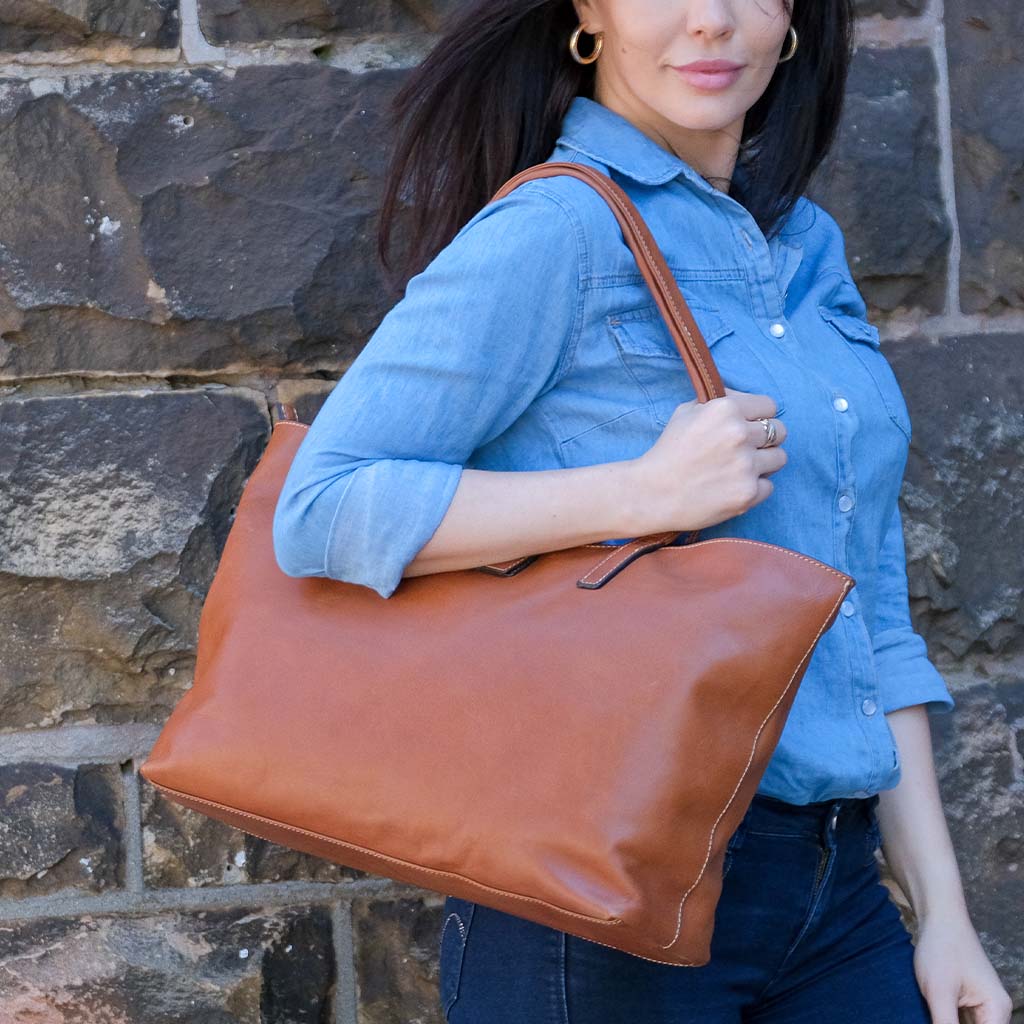 Large Ladies Laptop Shopper in Tan, featuring a minimalist design with spacious interior for laptops and documents.