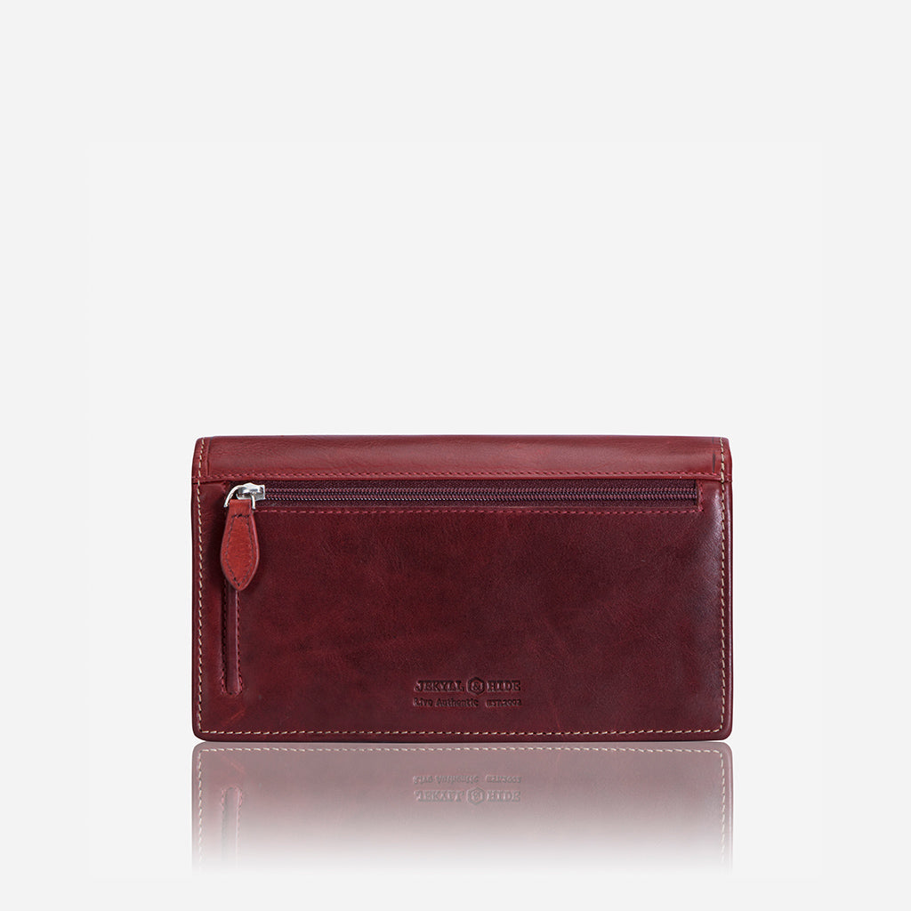 Large rust-colored leather purse with concertina design, showcasing its spacious interior and elegant finish.