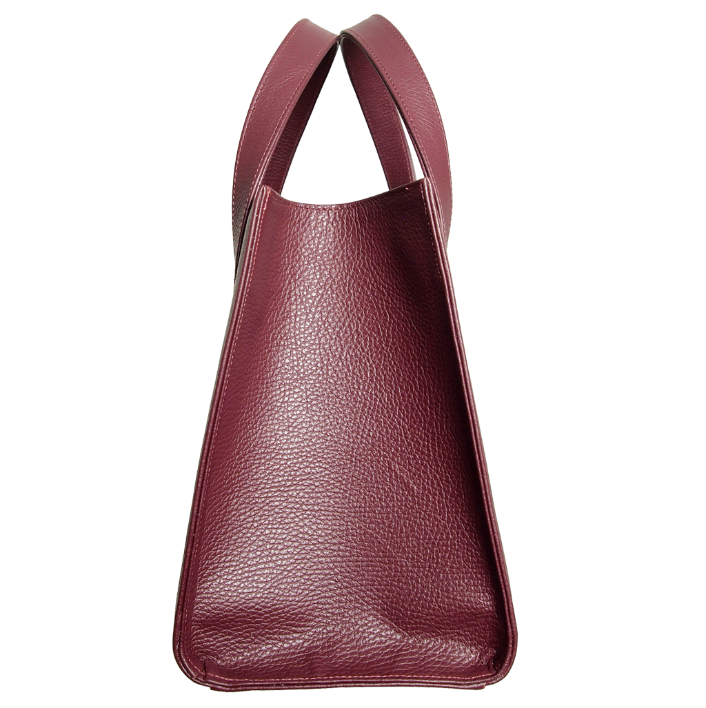 Large Bordeaux tote bag made of pebbled calf leather, featuring a spacious cotton-lined interior and minimal metal hardware.