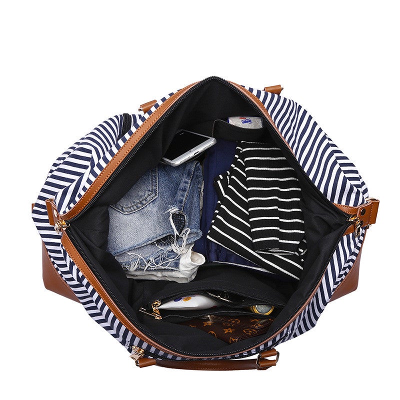 Large Striped Portable Canvas Travel Bag in blue stripes, showcasing its spacious design and durable canvas material.