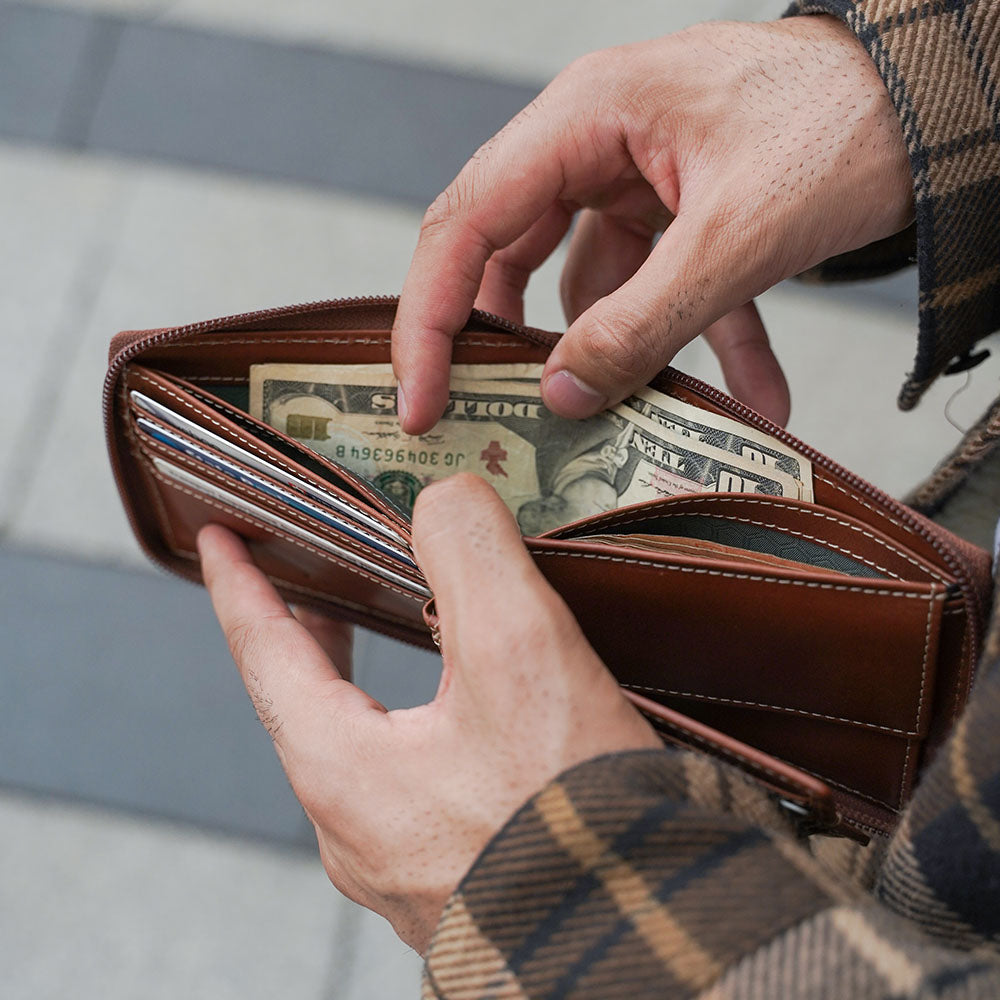 Large zip around wallet in clay color with coin pocket and ID window, designed for men.