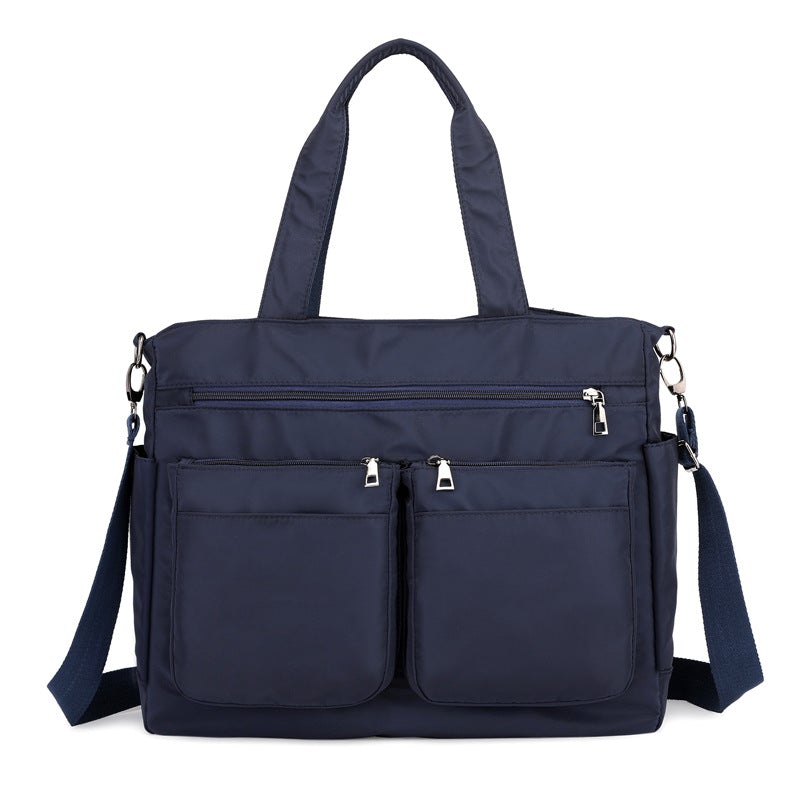 Large-capacity Lady's Oxford Cloth Messenger Bag in stylish design, featuring multiple pockets and zipper closure, perfect for daily use.