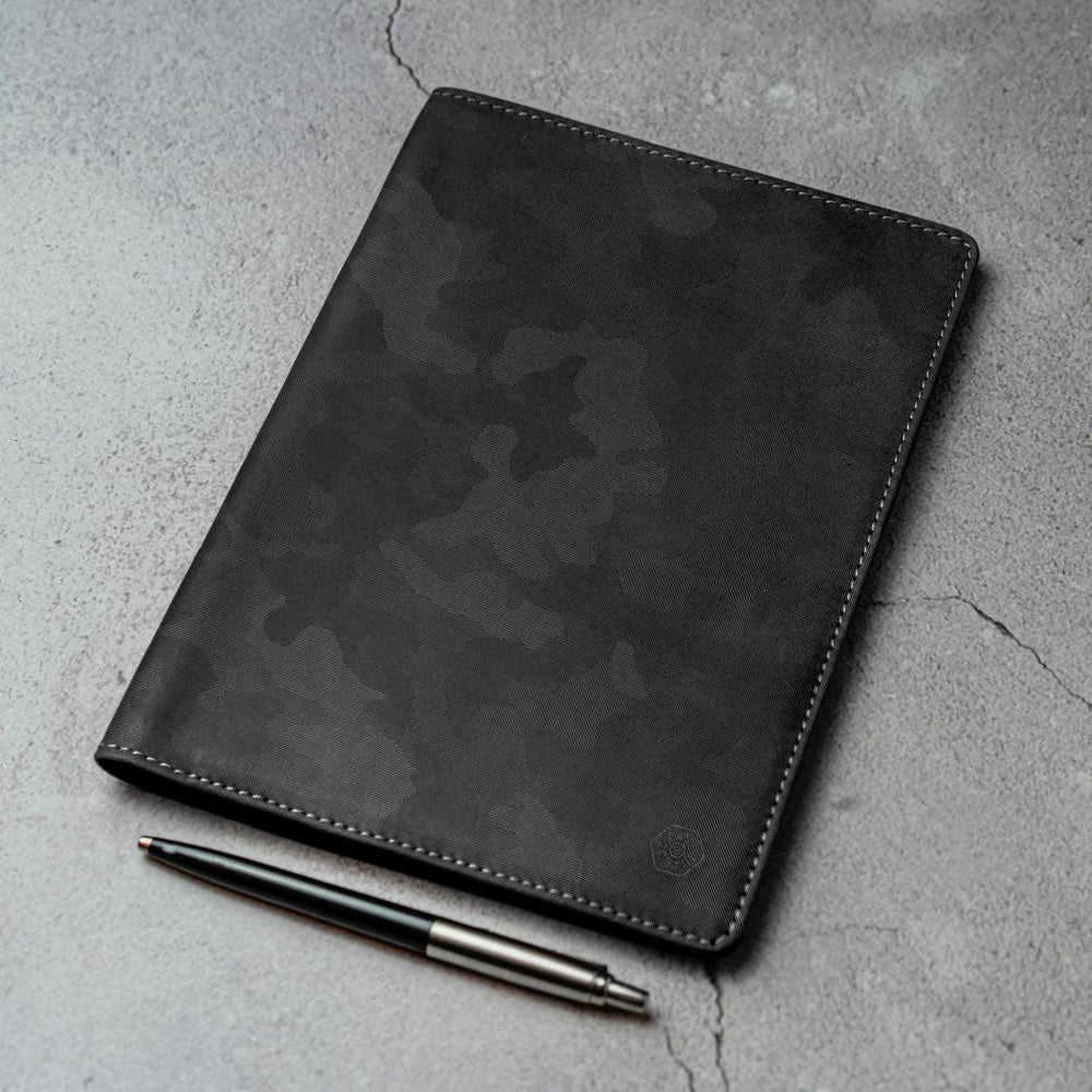 Leather A5 Notebook Cover in Camo with card and pen slots, showcasing its stylish design and functionality.