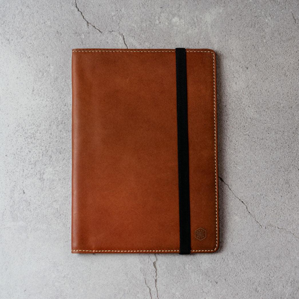 Leather A5 Notebook Cover in Clay color, featuring card slots and a pen holder.