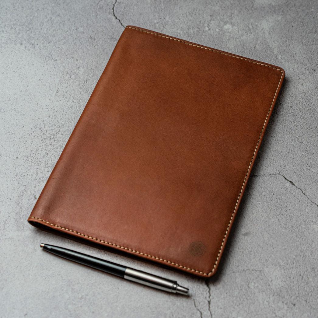 Leather A5 Notebook Cover in Clay color, featuring card slots and a pen holder.