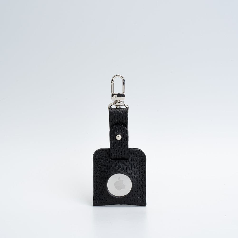 A stylish leather AirTag bag charm featuring a carabiner, handcrafted from premium Italian leather in various colors.