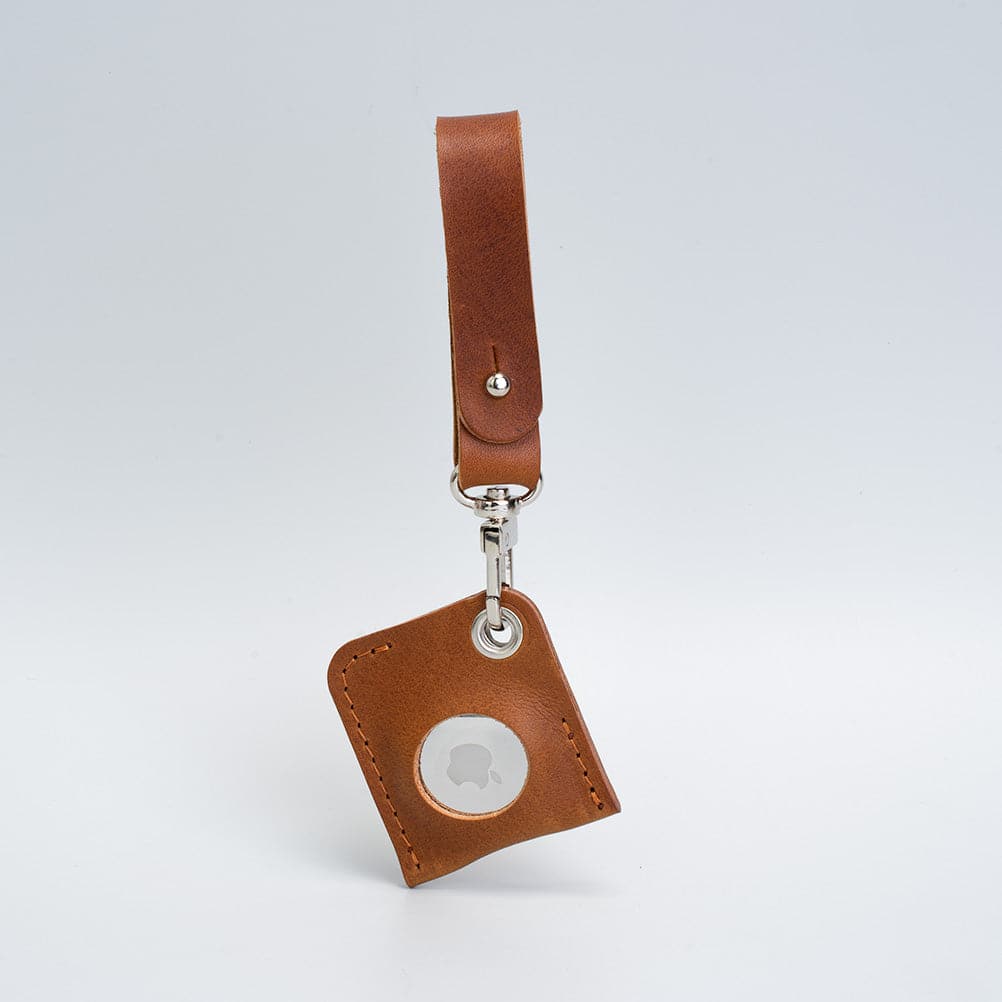 A stylish Leather AirTag bag charm made from premium Italian leather, showcasing its rich texture and customizable features.