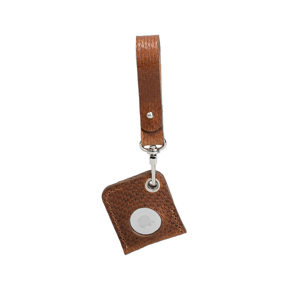 A stylish Leather AirTag bag charm made from premium Italian leather, showcasing its rich texture and customizable features.