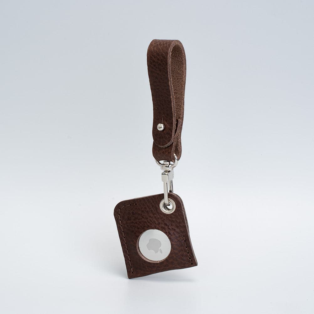 A stylish Leather AirTag bag charm made from premium Italian leather, showcasing its rich texture and customizable features.