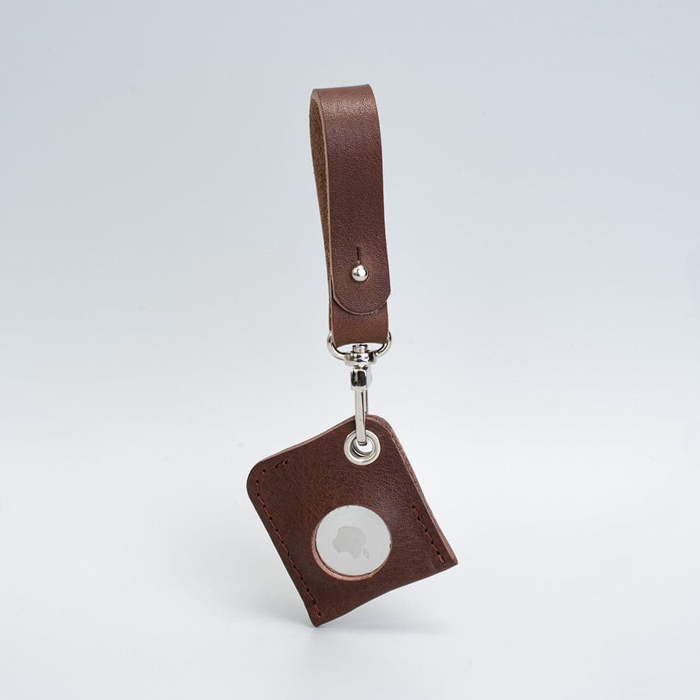 A stylish Leather AirTag bag charm made from premium Italian leather, showcasing its rich texture and customizable features.