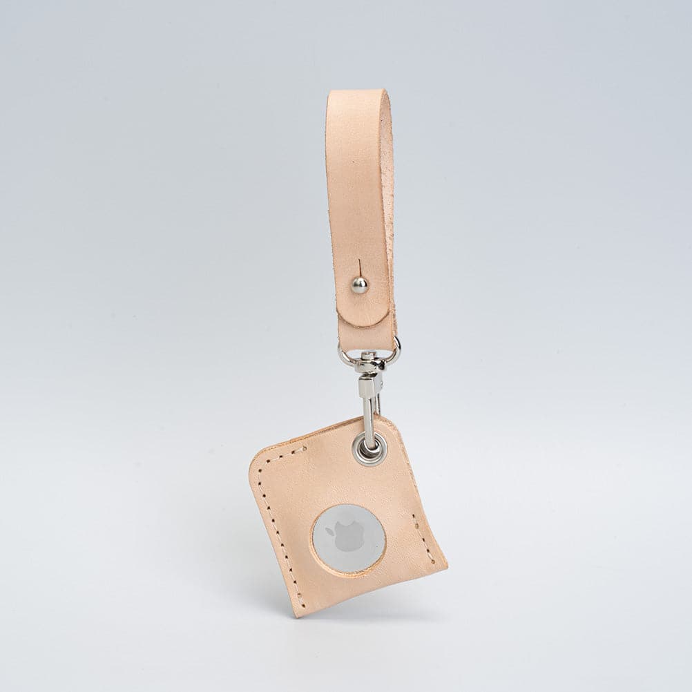 A stylish Leather AirTag bag charm made from premium Italian leather, showcasing its rich texture and customizable features.