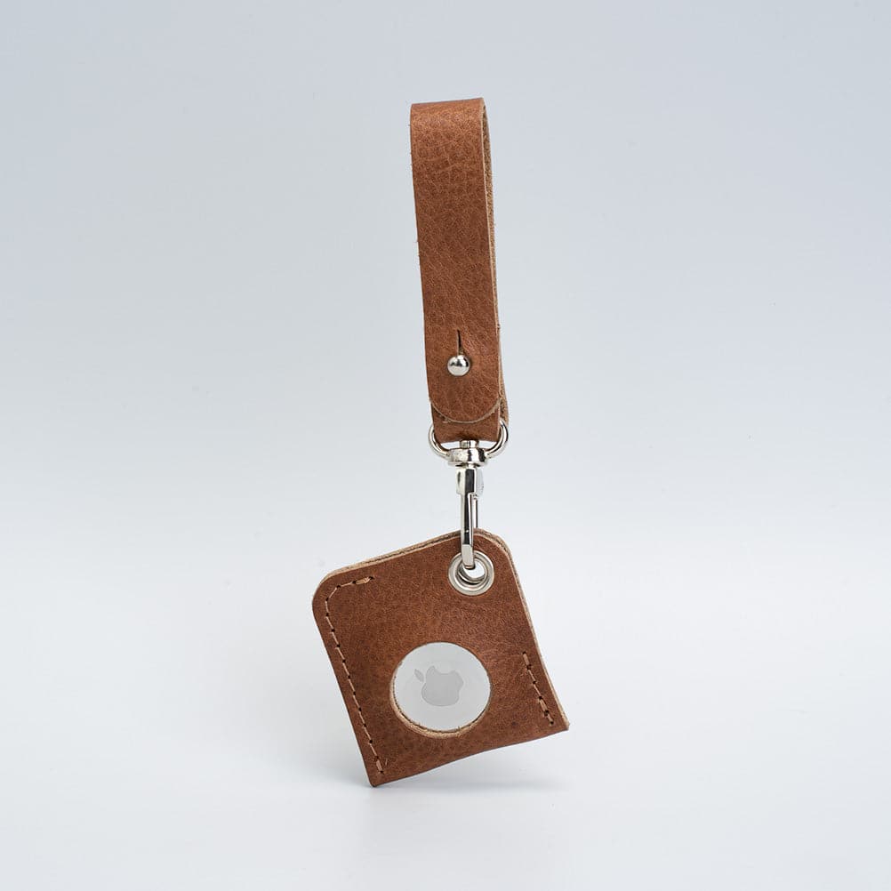 A stylish Leather AirTag bag charm made from premium Italian leather, showcasing its rich texture and customizable features.