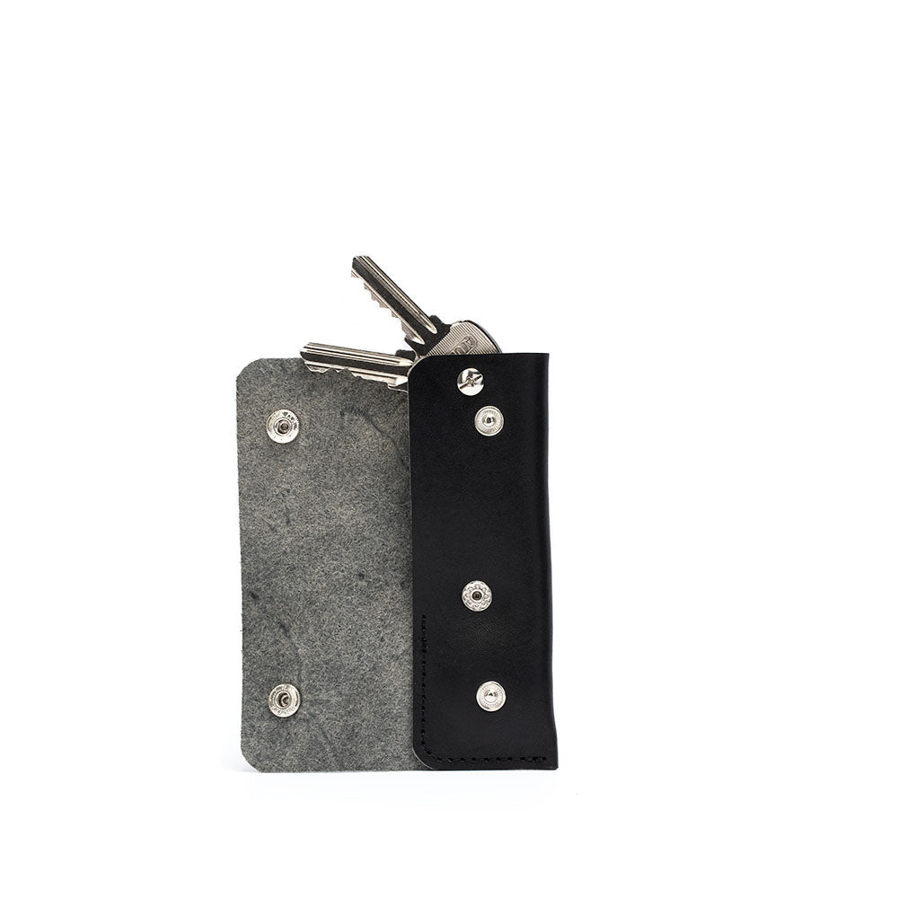 Leather AirTag Key Case 3.0 in premium Italian leather with golden hardware, holding an AirTag and keys.