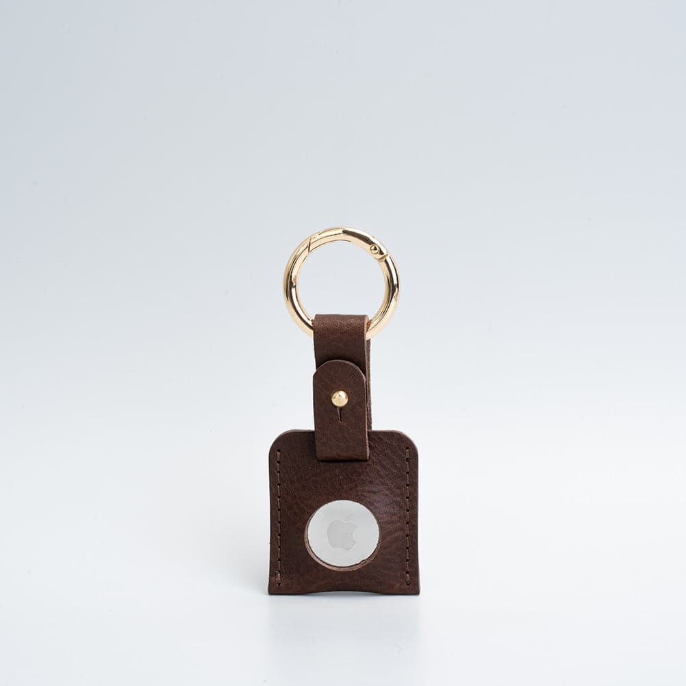 A stylish Leather AirTag Keychain made from premium Italian leather, featuring a durable circle carabiner and customizable design options.