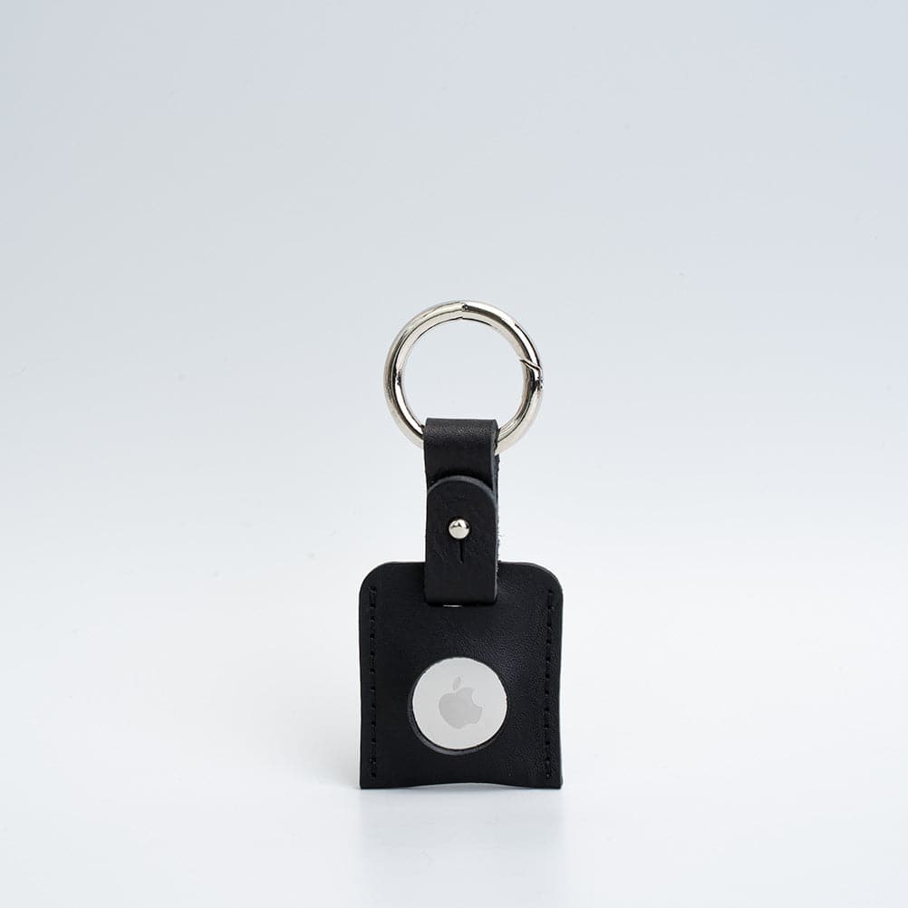 A stylish Leather AirTag Keychain made from premium Italian leather, featuring a durable circle carabiner and customizable design options.