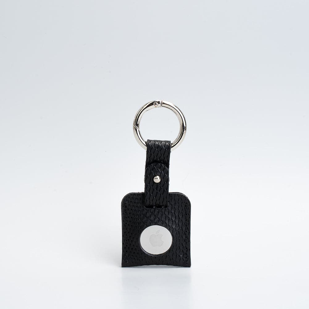 A stylish Leather AirTag Keychain made from premium Italian leather, featuring a durable circle carabiner and customizable design options.