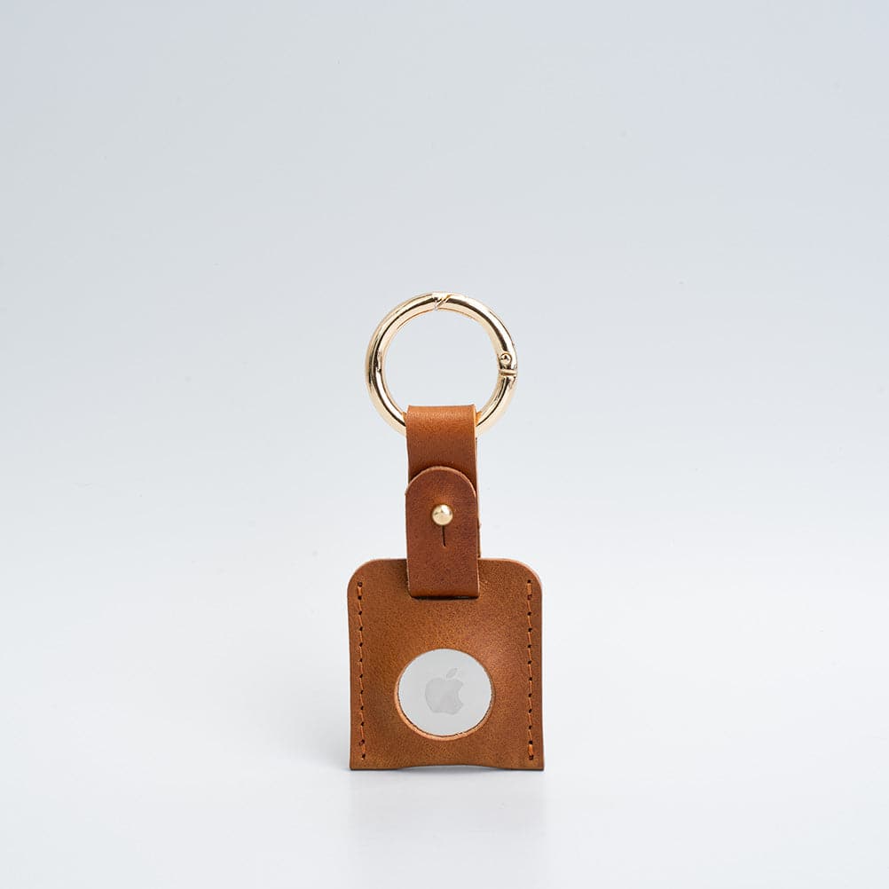 A stylish Leather AirTag Keychain made from premium Italian leather, featuring a durable circle carabiner and customizable design options.