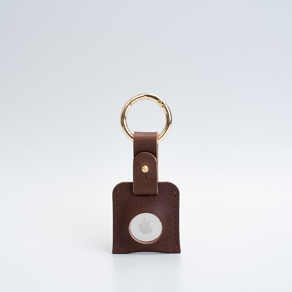 A stylish Leather AirTag Keychain made from premium Italian leather, featuring a durable circle carabiner and customizable design options.