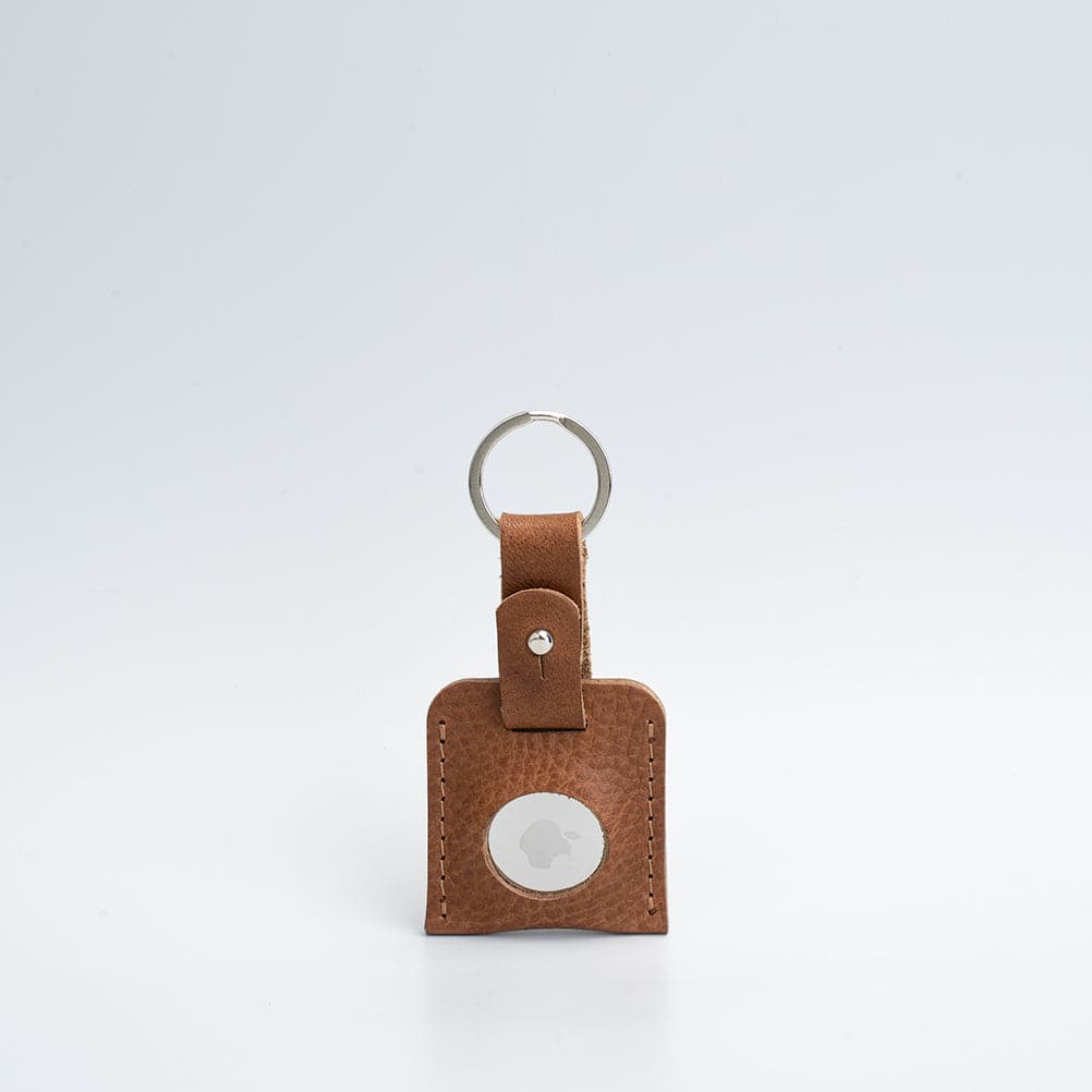 A stylish Leather AirTag Keyring made from premium Italian leather, showcasing its craftsmanship and customizable features.