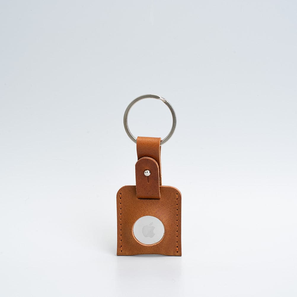 A stylish Leather AirTag Keyring made from premium Italian leather, showcasing its craftsmanship and customizable features.