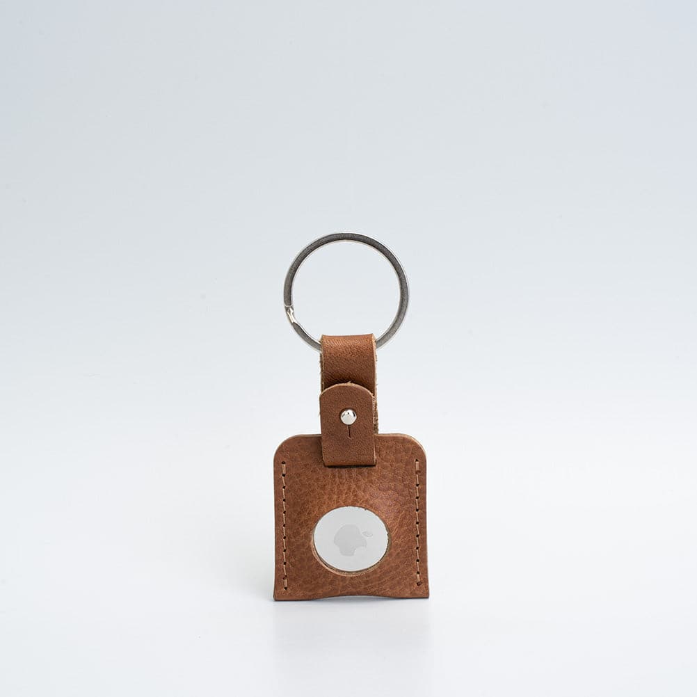 A stylish Leather AirTag Keyring made from premium Italian leather, showcasing its craftsmanship and customizable features.