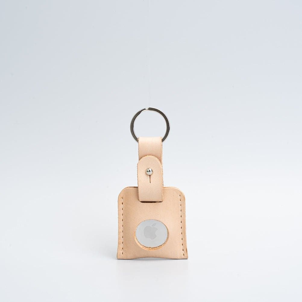 A stylish Leather AirTag Keyring made from premium Italian leather, showcasing its craftsmanship and customizable features.